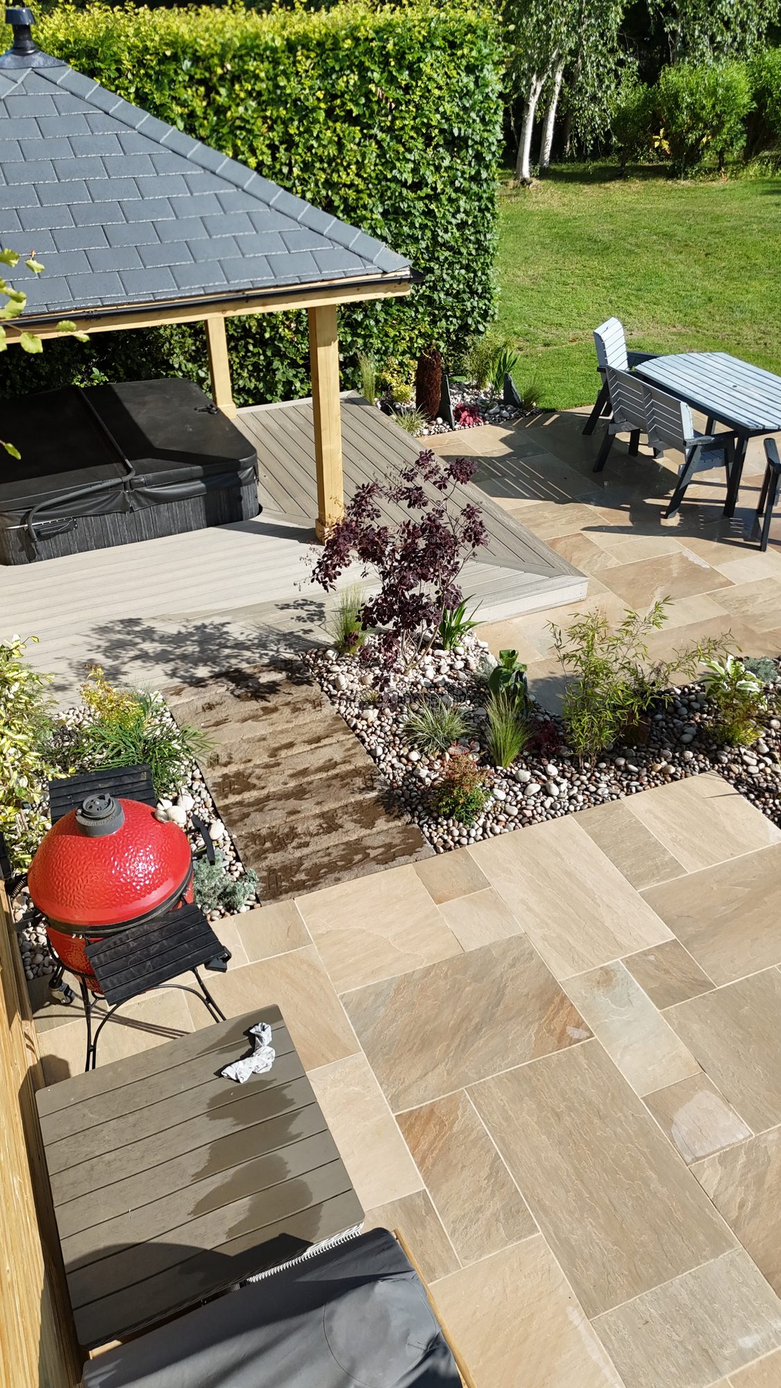 Aerial of a timber garden room and hot tub on composite decking