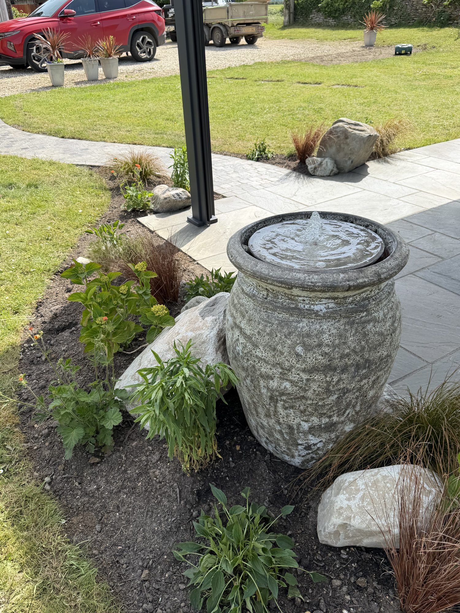 Close detail of a bubbling stone urn water feature